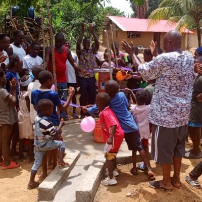 Grateful community during dedication ceremony of a new well 